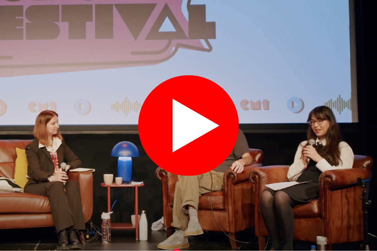 Marina Cusi, Steve Mortimer and Ada Mazi sitting on sofa chairs on stage